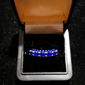Silver Tone Ring with Blue Sapphires completely around the Ring
